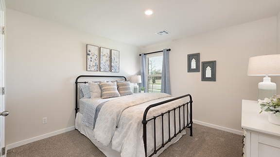 Front guest bedroom with carpet and windows