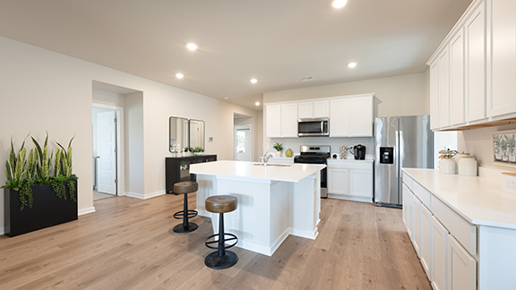 Kitchen with stainless steel appliances and quartz counter