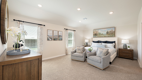 Primary bedroom with two large windows