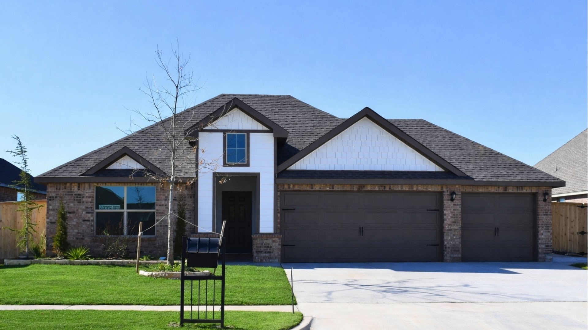 Single-story home rendering with two-car garage.