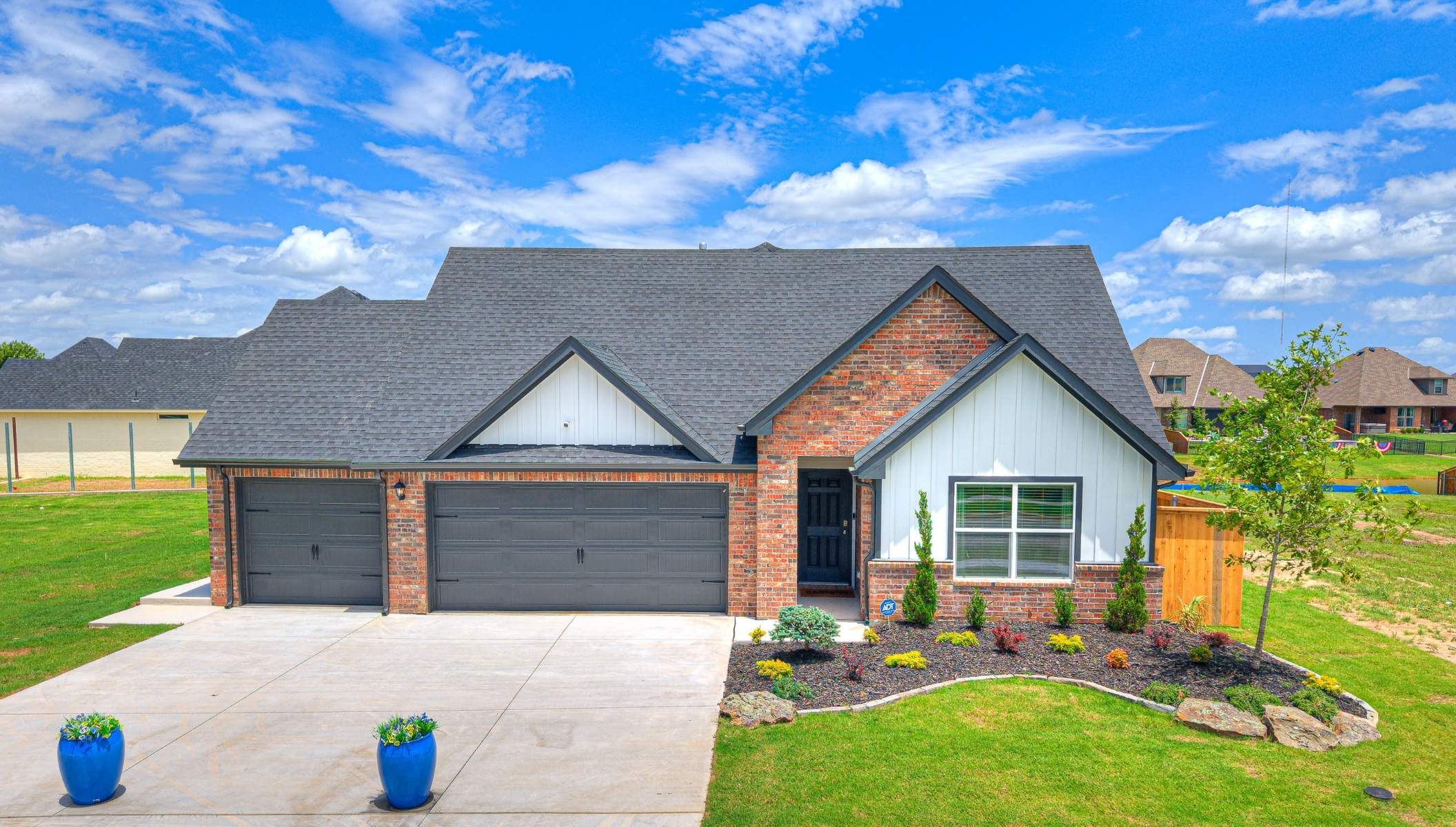 Single story home exterior with 3 car garage