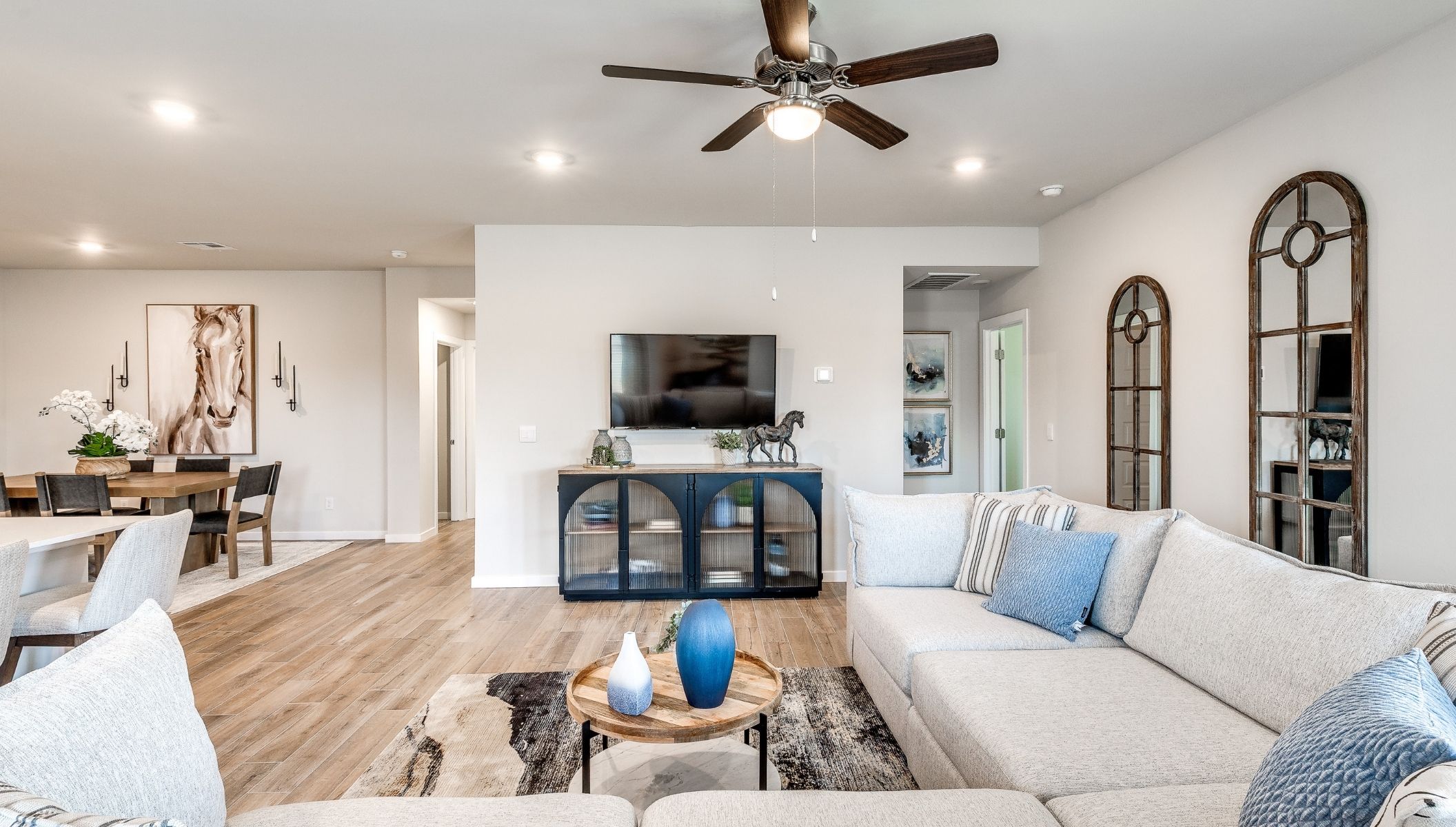 living area opening to dining area and kitchen