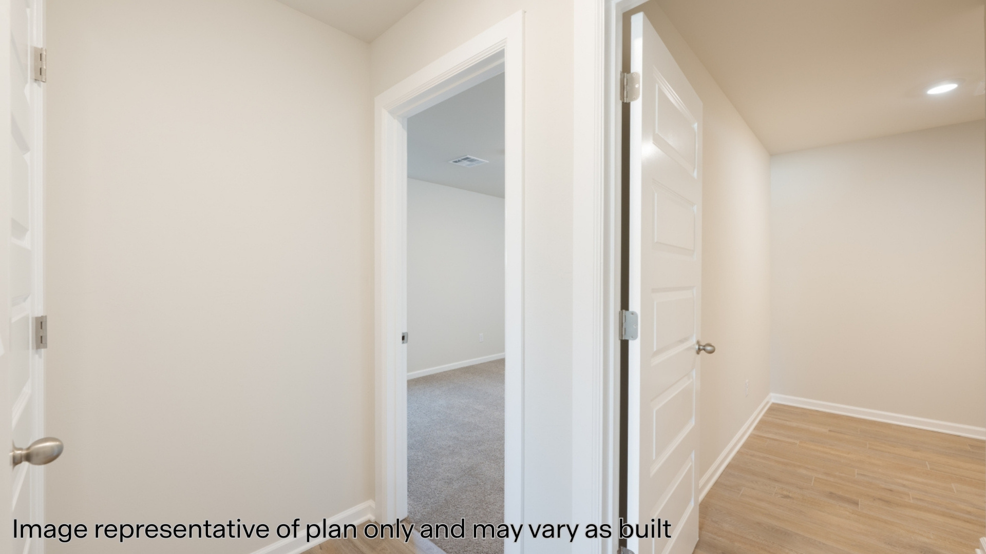 Secondary bedroom with carpet and windows