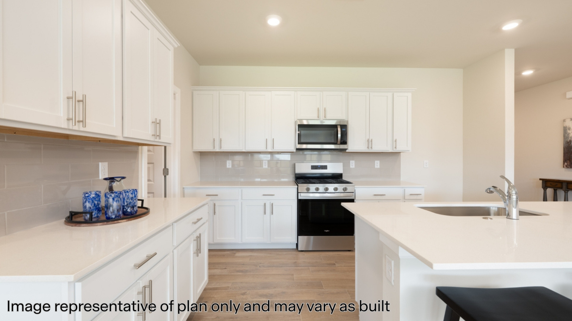 Kitchen with stainless steel appliances and quartz countertops