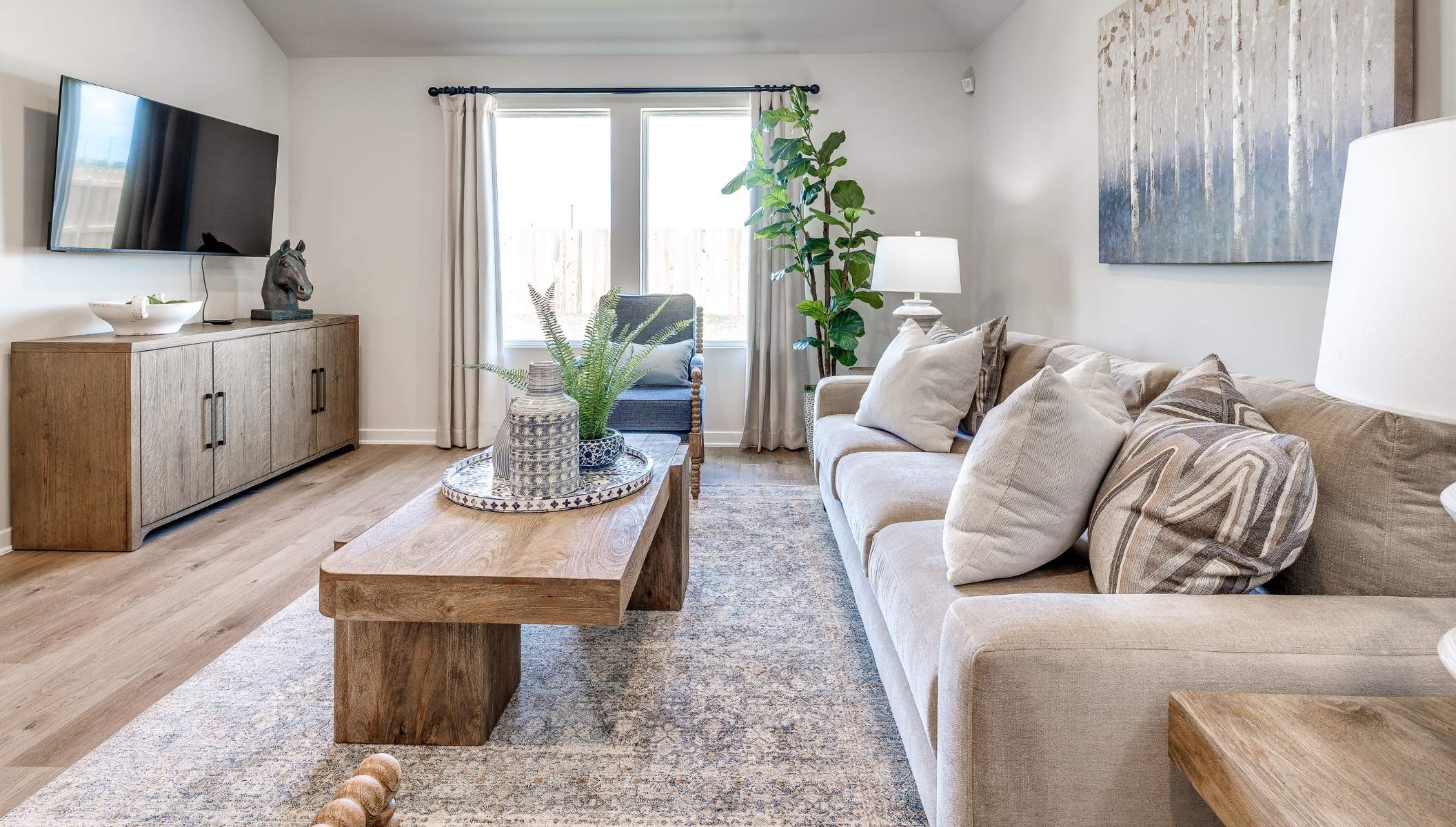 carpeted living room with large window