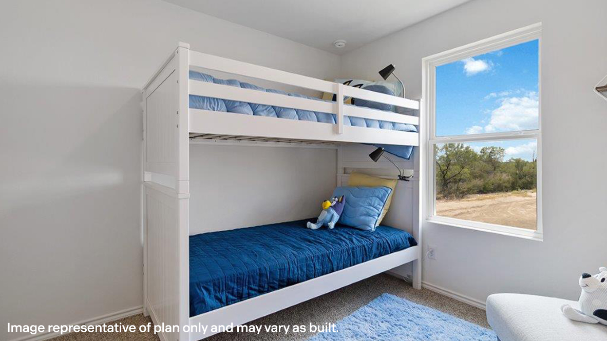 Carpeted bedroom featuring baseboards