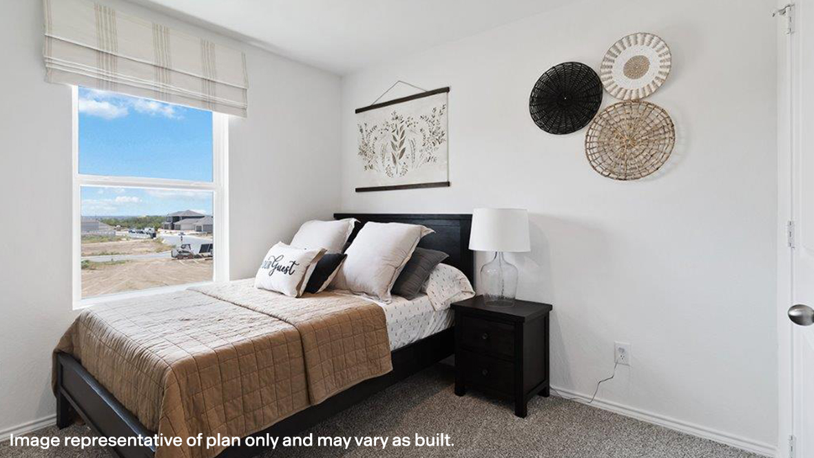 Carpeted bedroom with baseboards