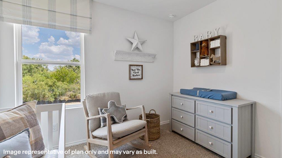 Sitting room with carpet floors and baseboards
