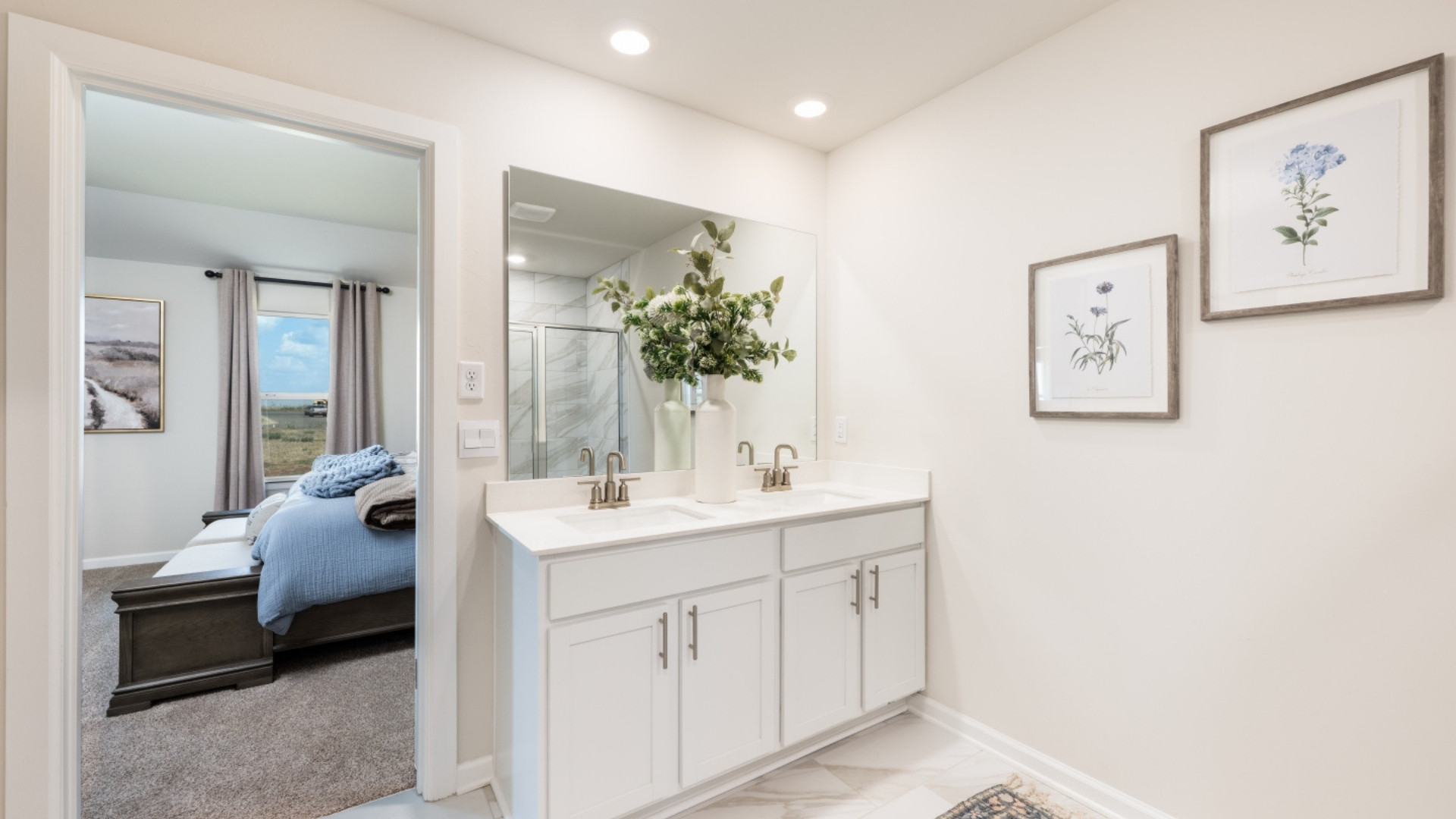 Primary bathroom with enclosed shower and dual sinks