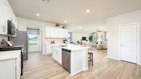 Kitchen with quartz countertops and stainless steel appliances