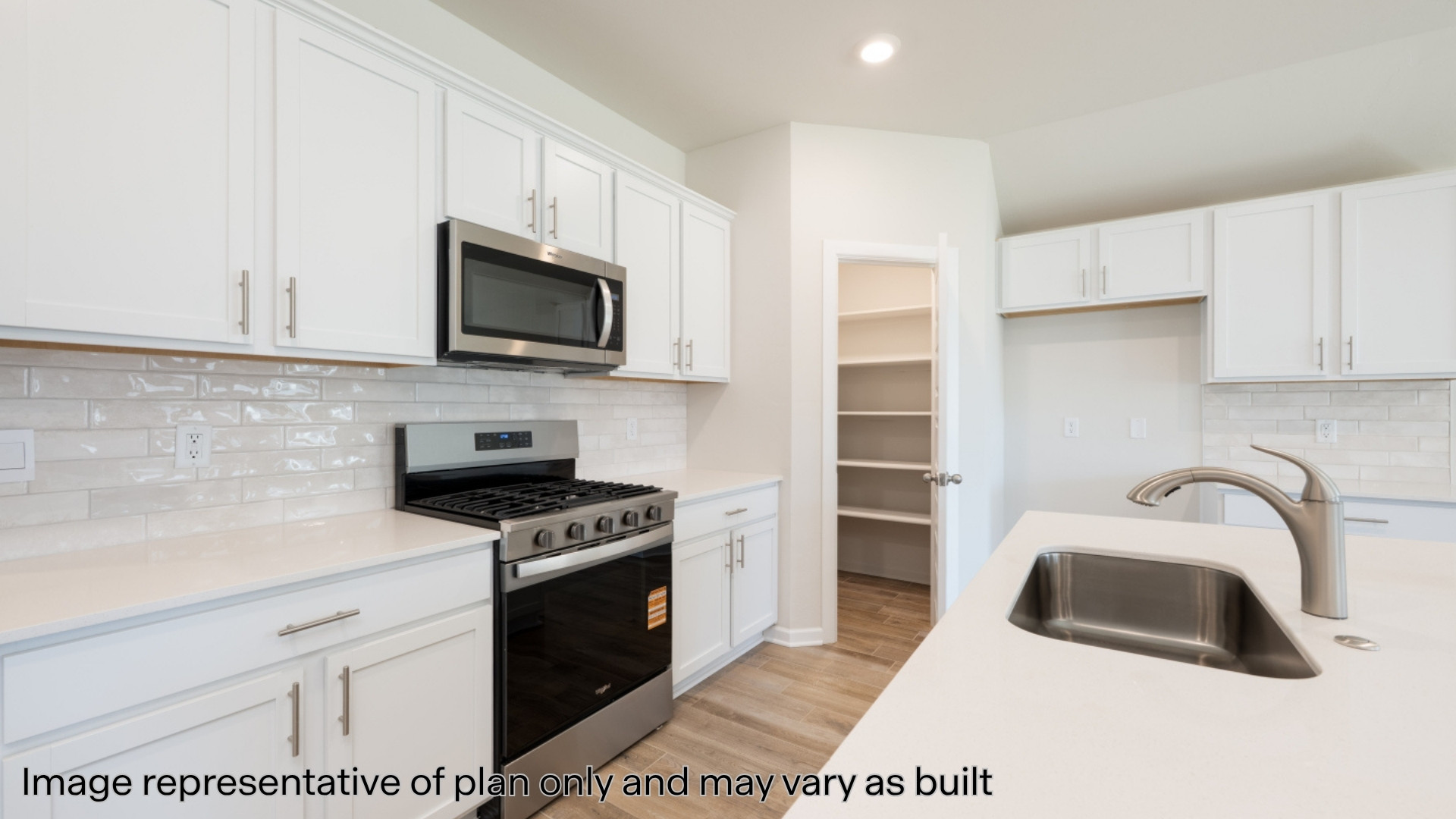 Kitchen with quartz counter and stainless steel appliances