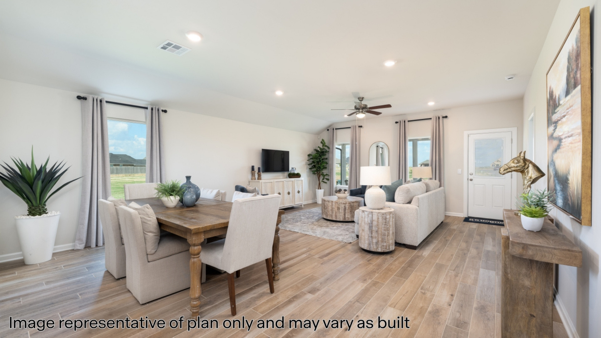 Dining room featuring wood finish floors, plenty of natural light, recessed lighting, vaulted ceiling, and a ceiling fan