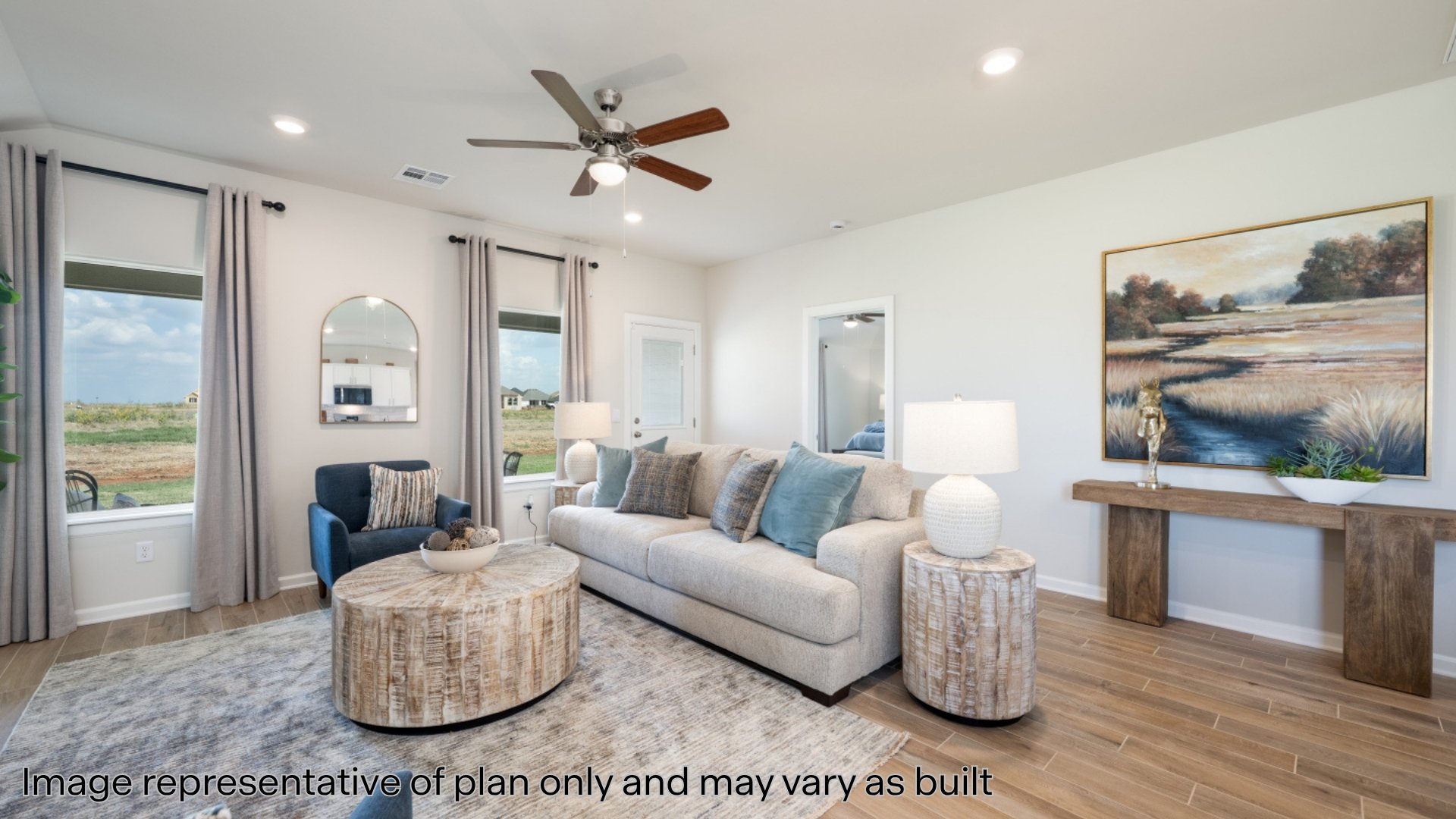 Living area with wood tiled floors, ceiling fan, and recessed lighting