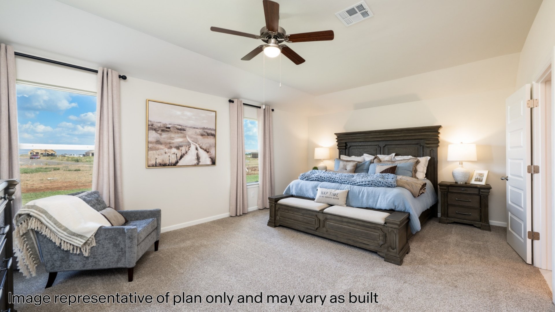 Bedroom featuring light colored carpet and ceiling fan