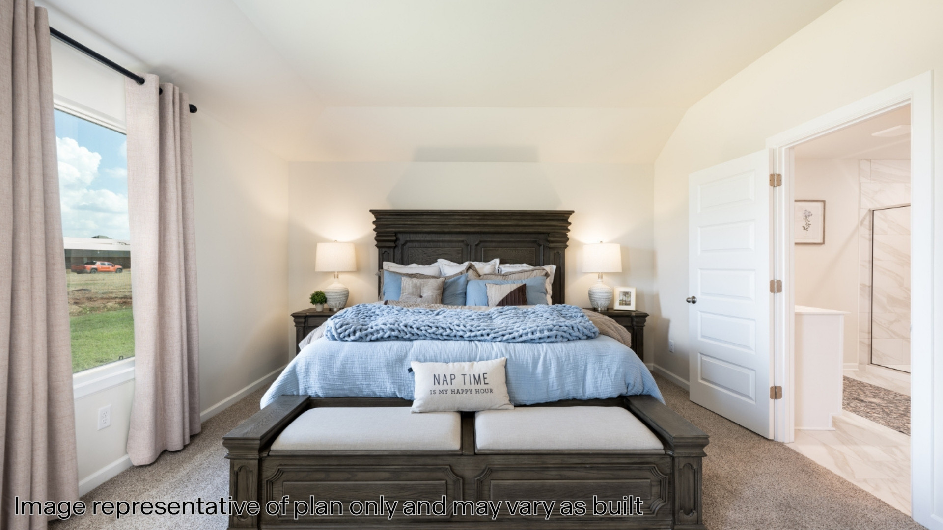 Bedroom with light carpet and lofted ceiling