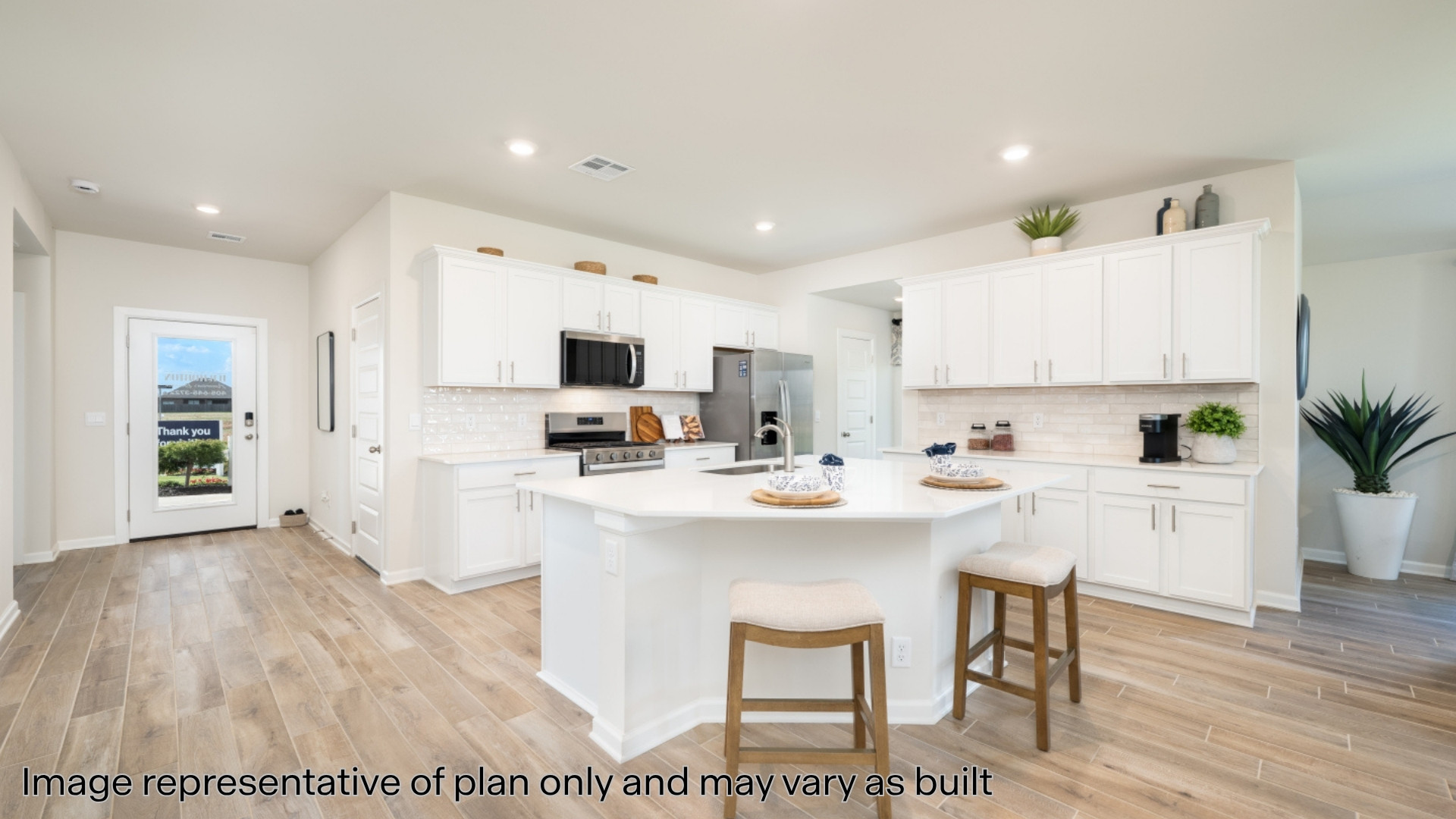 Kitchen with quartz countertops and stainless steel appliances