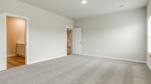 Unfurnished bedroom with carpet flooring, recessed lighting, and ensuite bath