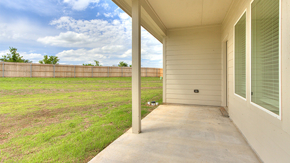 Fenced backyard featuring a patio area
