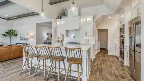 kitchen with island and lighting
