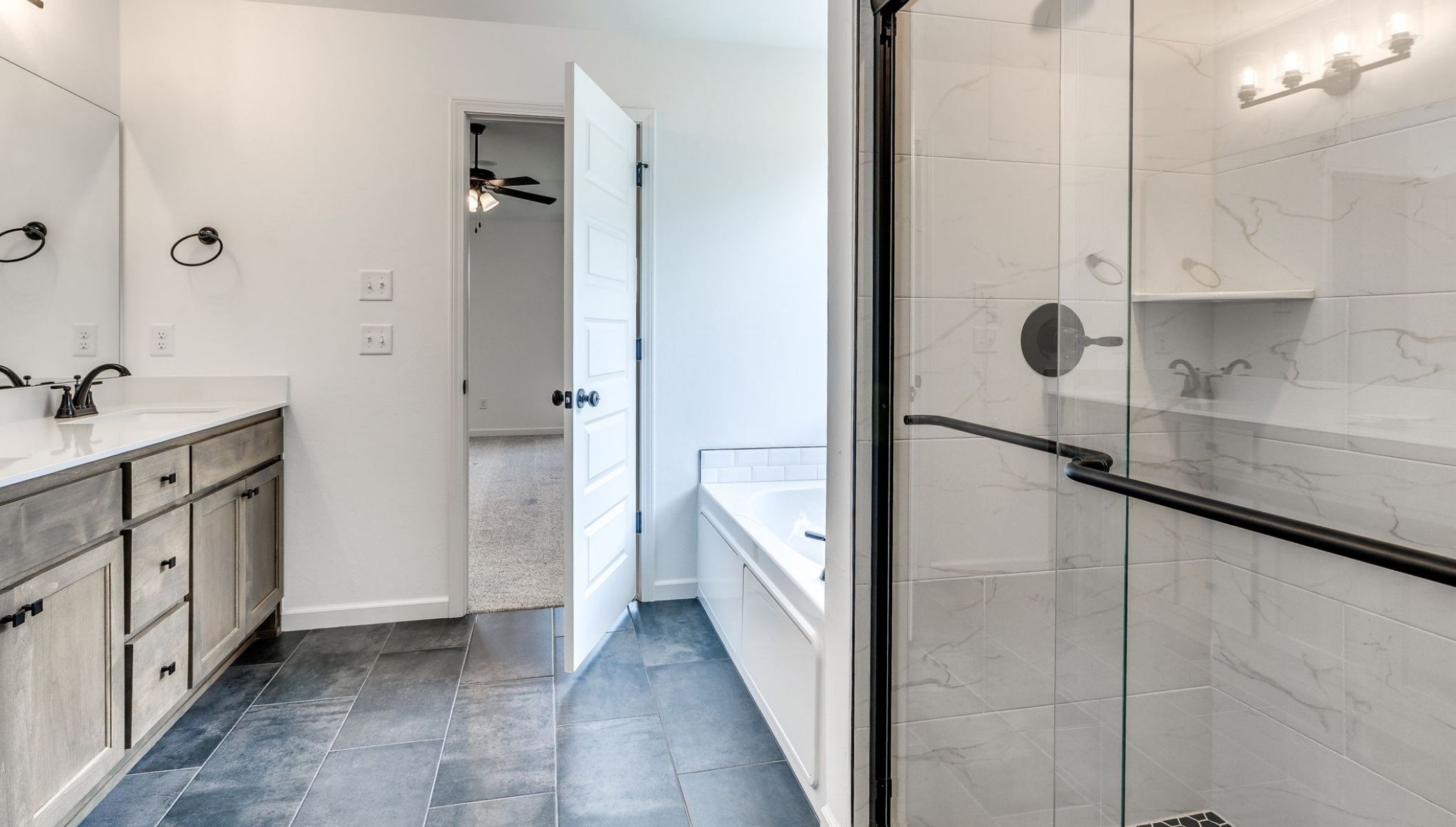 primary bathroom shower and vanity