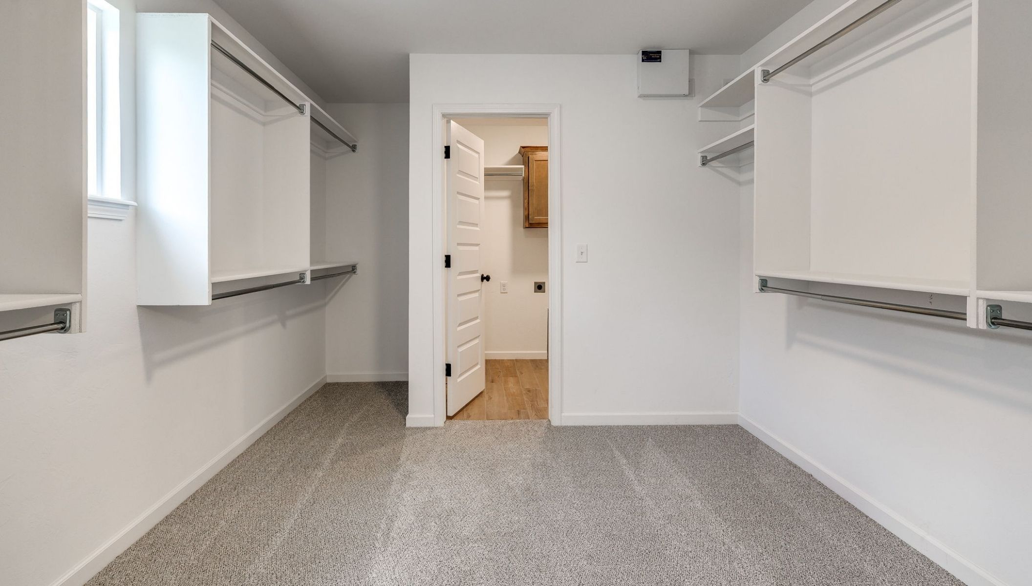 large walk-in closet in primary bathroom