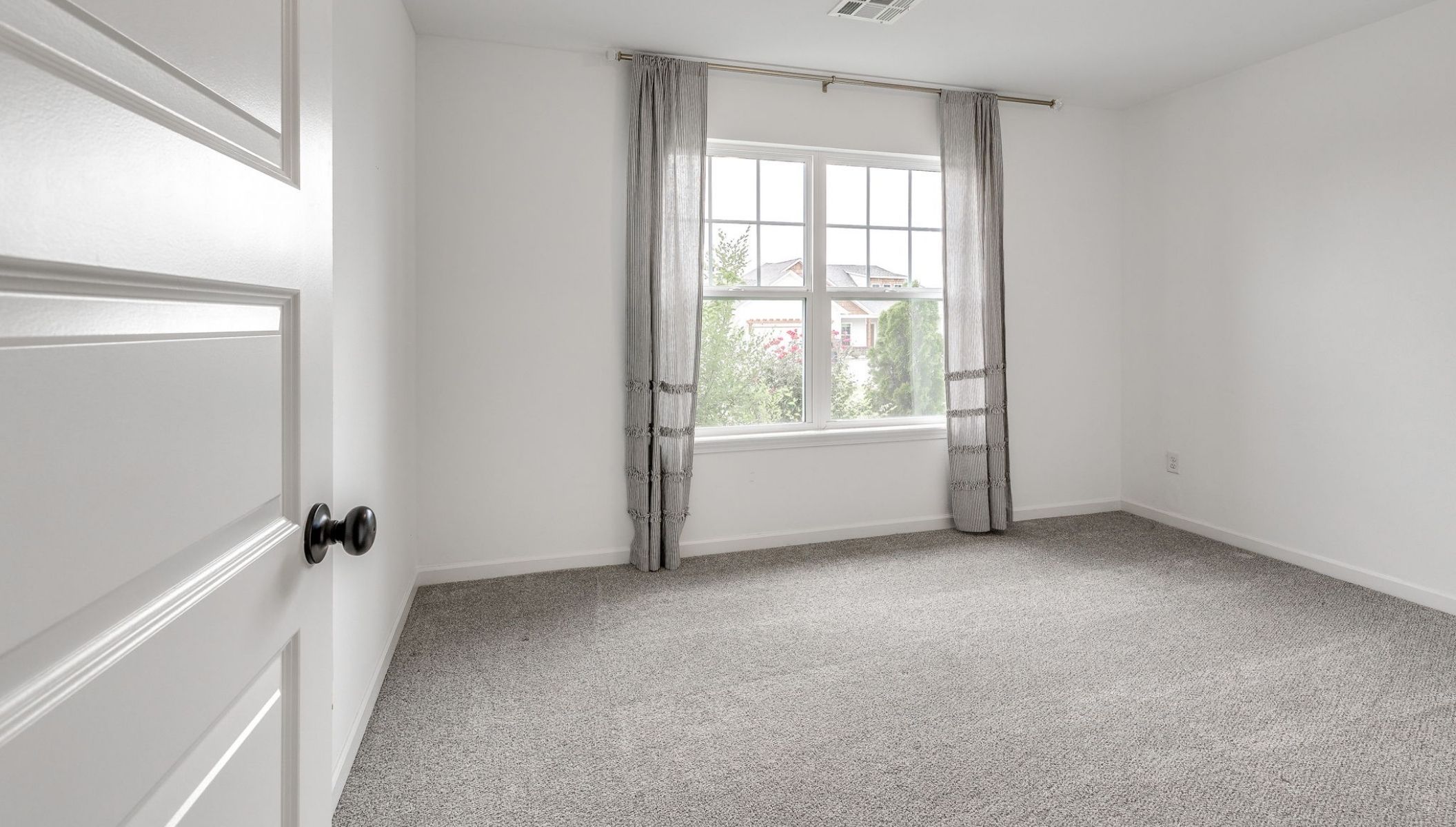 secondary bedroom with large window
