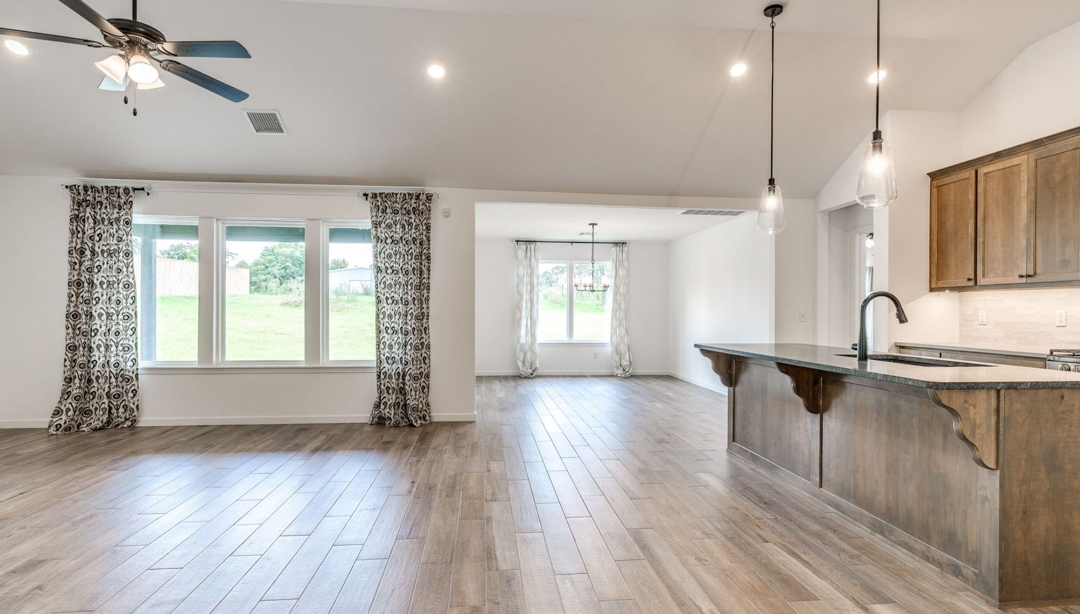 living room and kitchen with windows