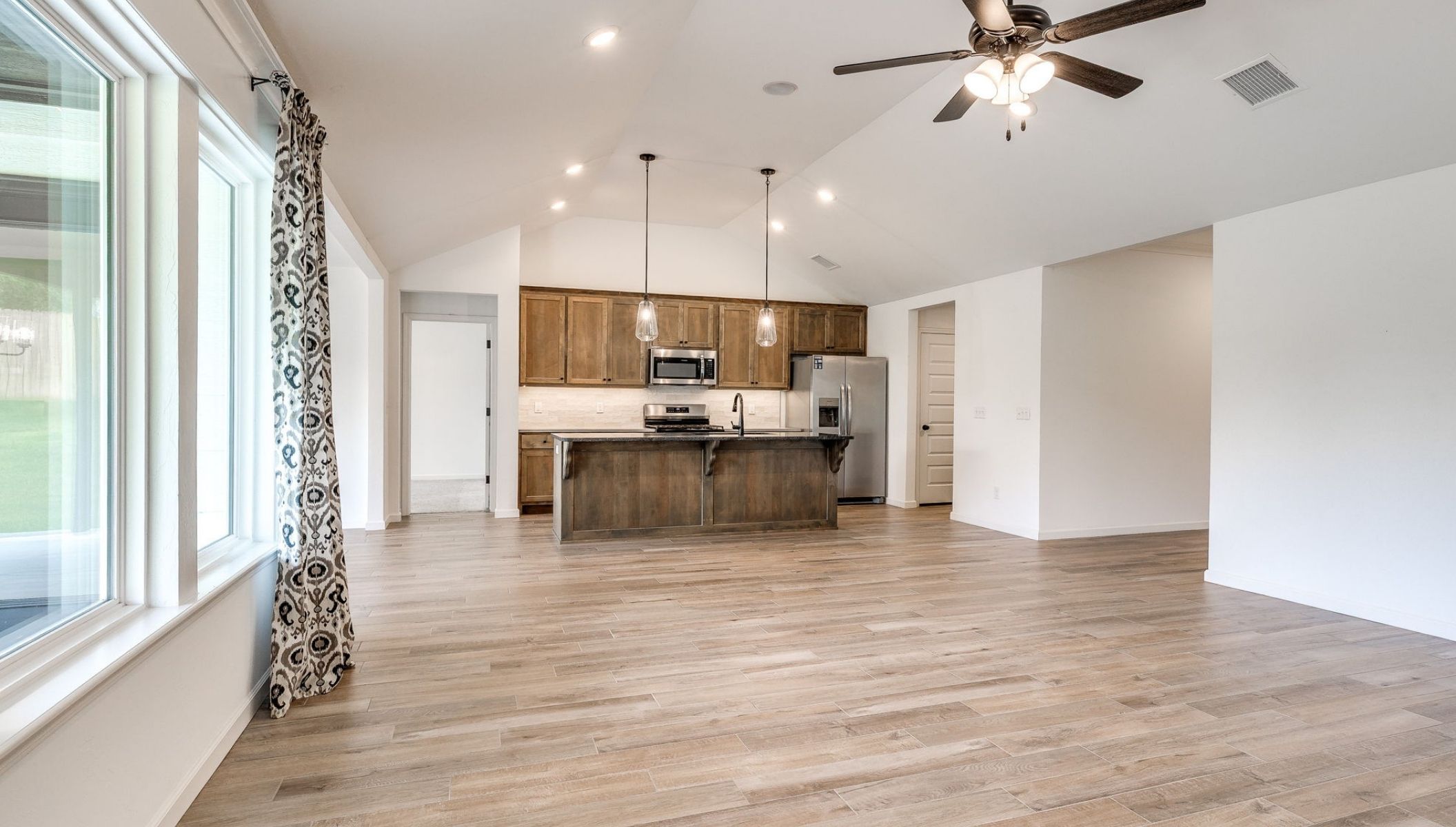 living room opening to kitchen