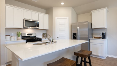 kitchen island and painted cabinets