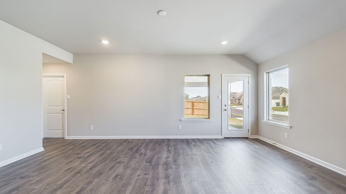 The single story Lakeview home plan has a spacious kitchen and island with granite countertops.