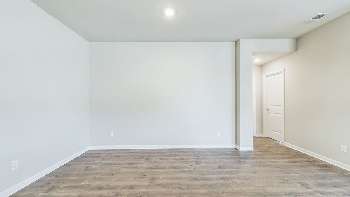 The single story Lakeview home plan bedroom has lots of natural light.