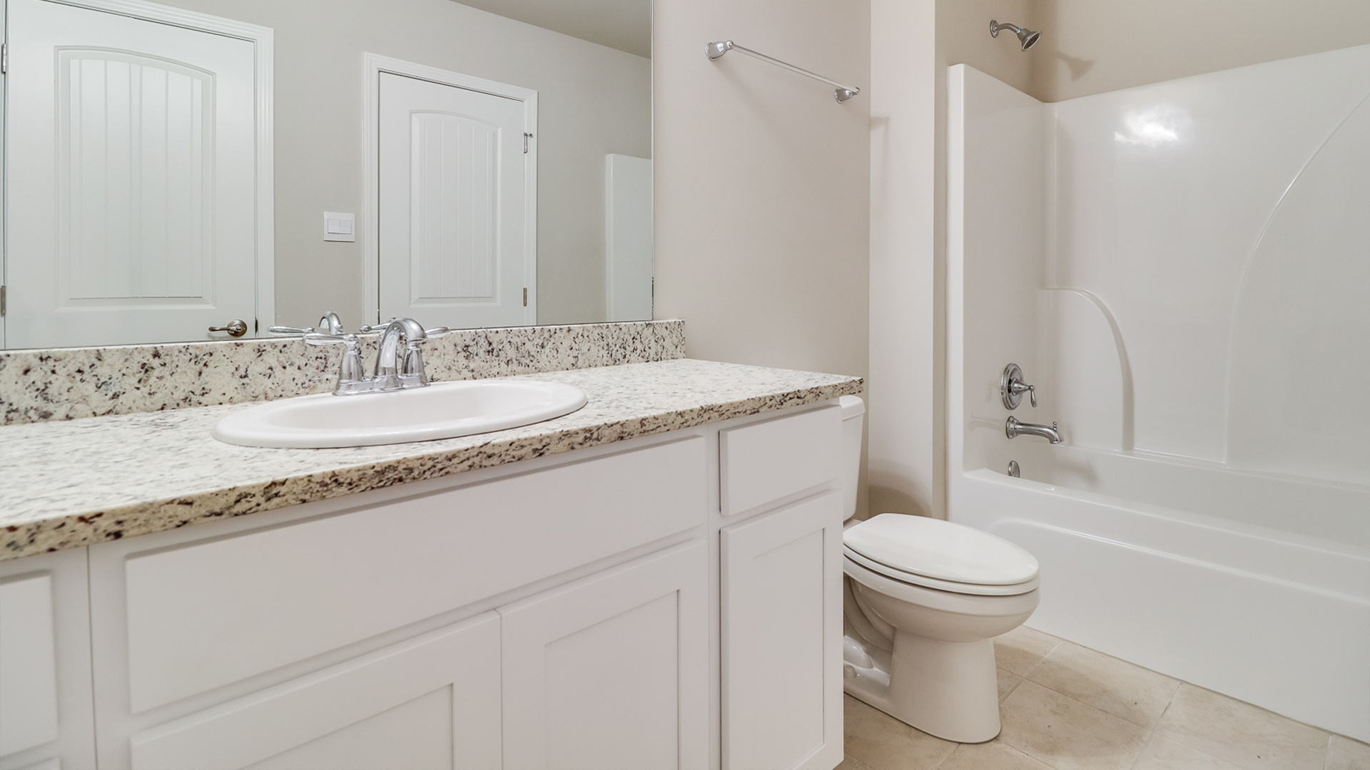 Bathroom featuring a sink, toilet, and shower tub.