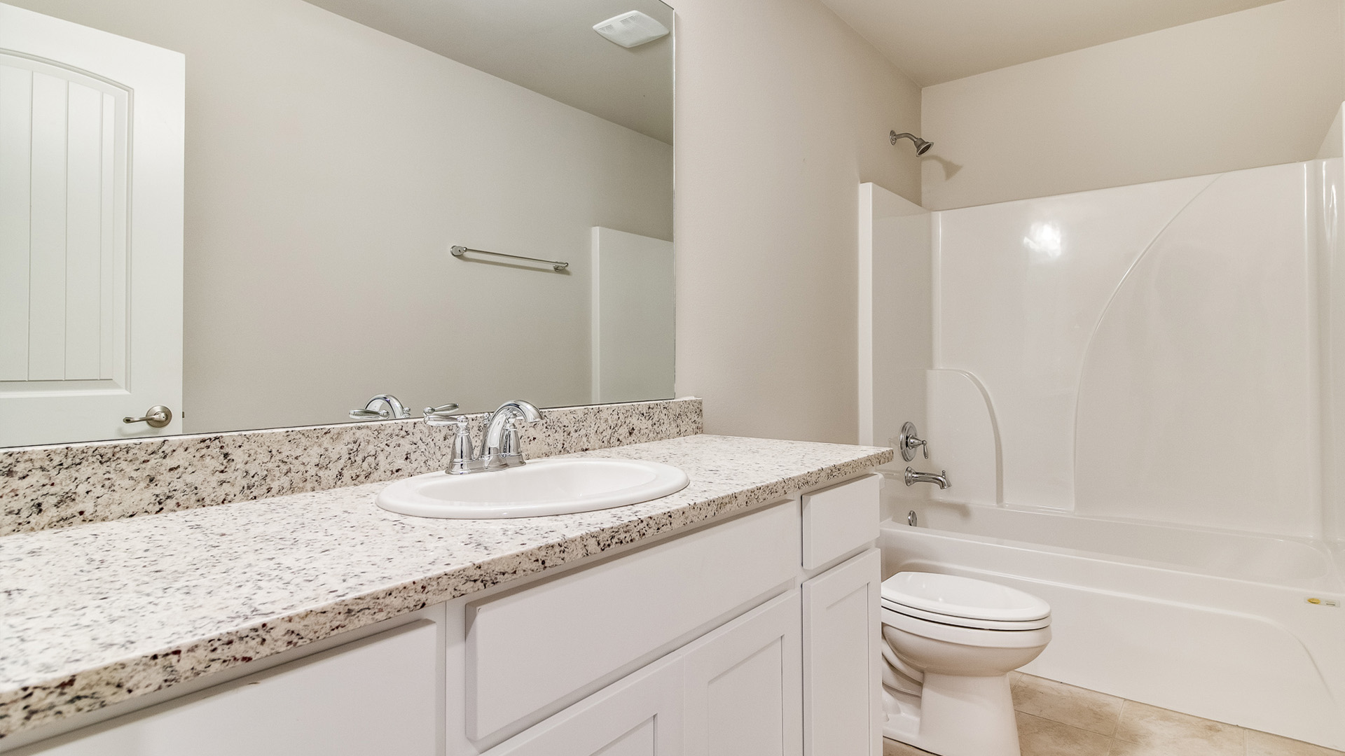 Bathroom featuring a sink, toilet, and shower tub.