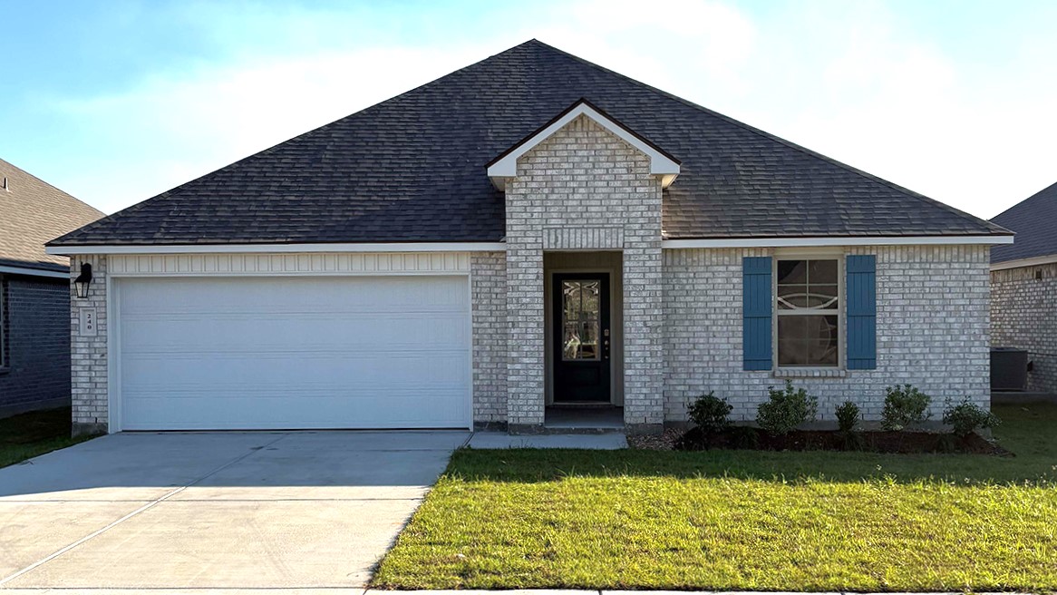 front exterior of a one story home with a two car garage