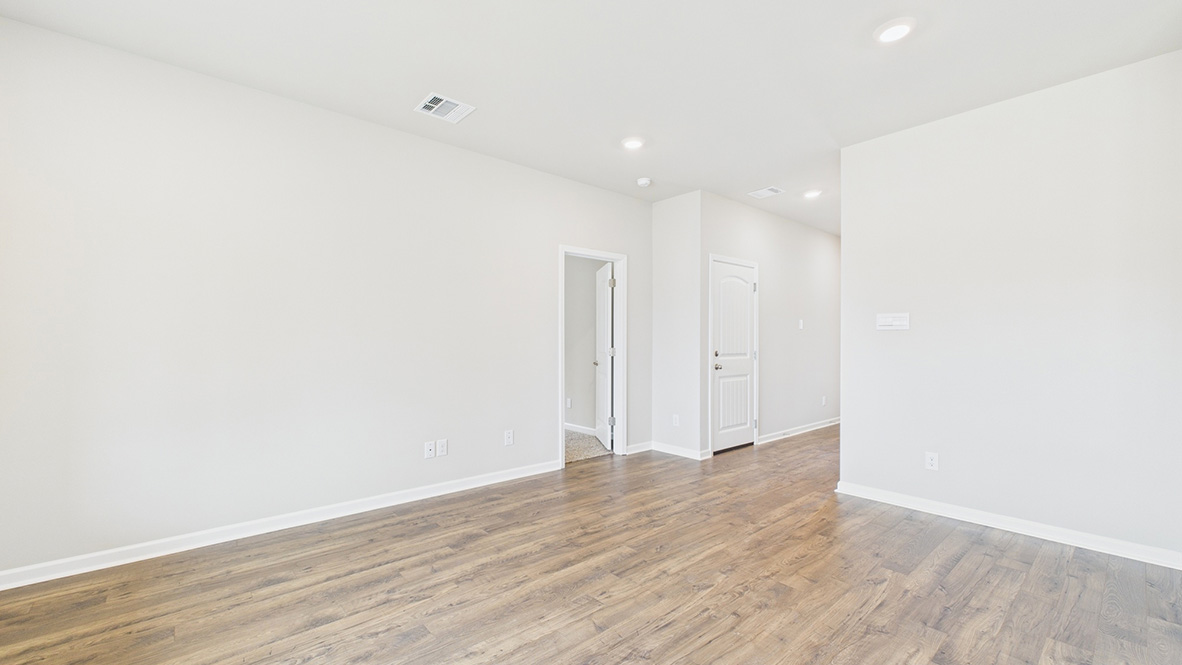 Main living area with clean flooring and natural light.
