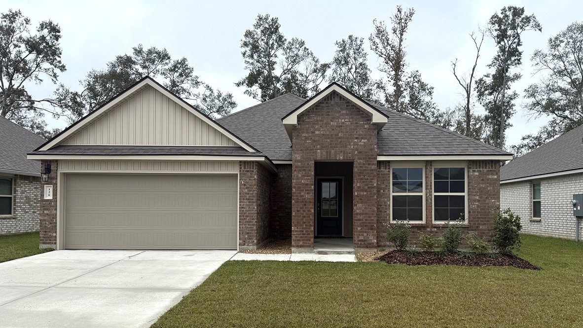 Single story new build home with a neutral exterior and a two car garage.