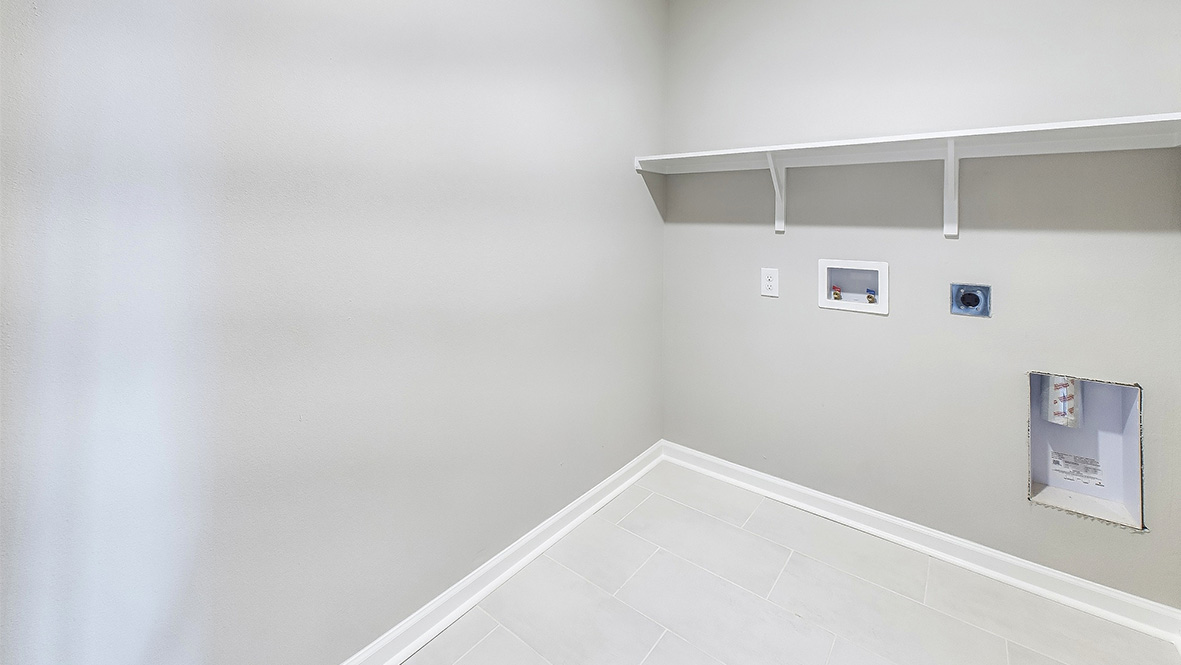 Hollis Heights utility laundry smartly designed with overhead organized storage, a drop zone, with new washer, dryer included