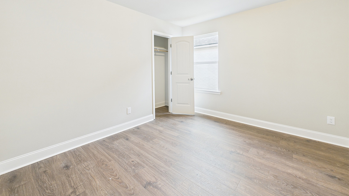 View of bedroom overlooking the closet and hallway doors