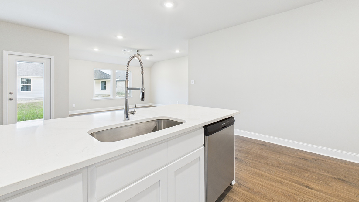 kitchen with white cabinetry, large island and stainless steel appliances