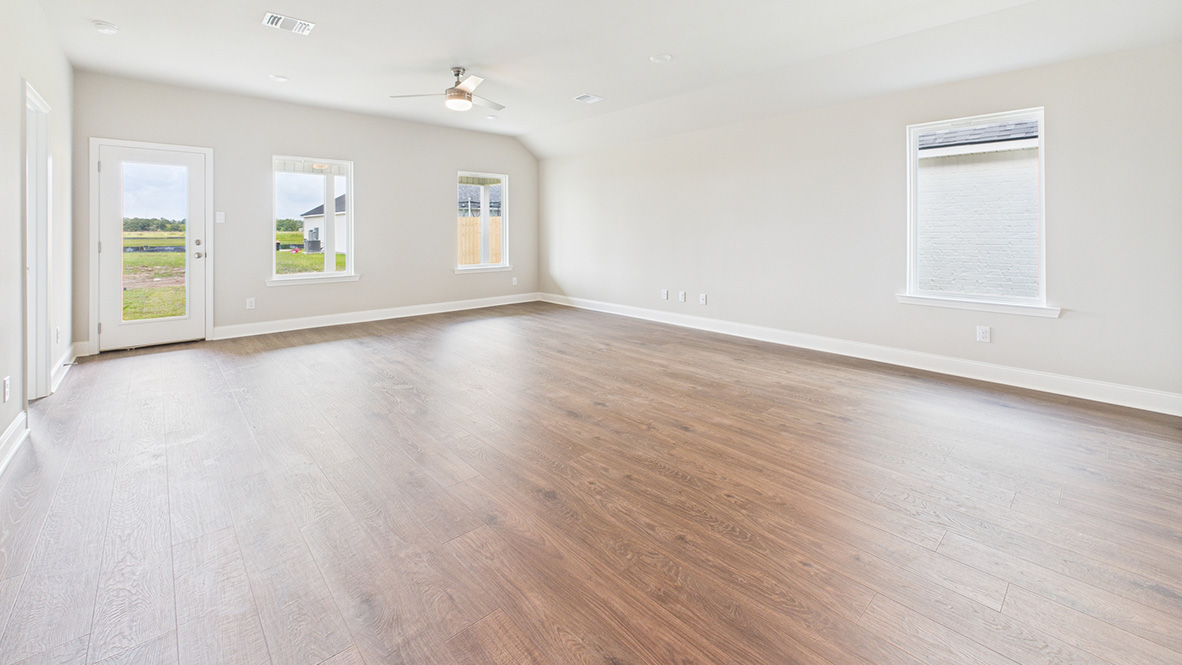 View from dining room into kitchen into living room and outdoor backyard access at Ridgeland