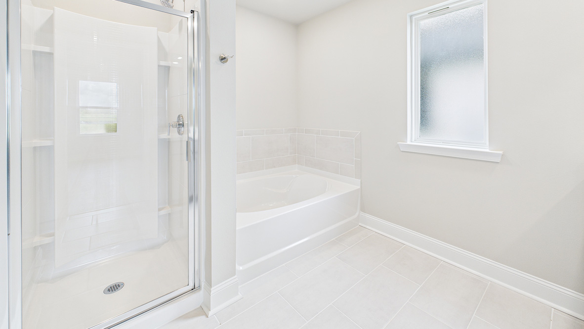 Owner’s ensuite in a D.R. Horton new build home offers function and style with a walk-in closet, spa-like ensuite
