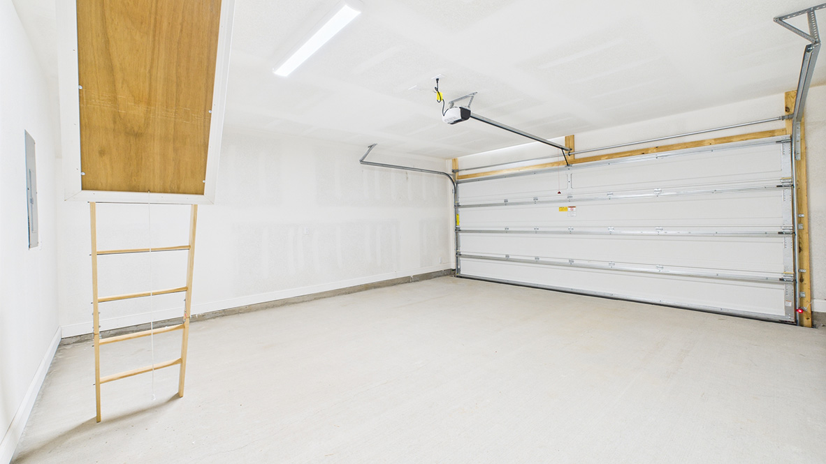 New home view of garage, garage door, storage potential by D.R. Horton featuring one story connectivity