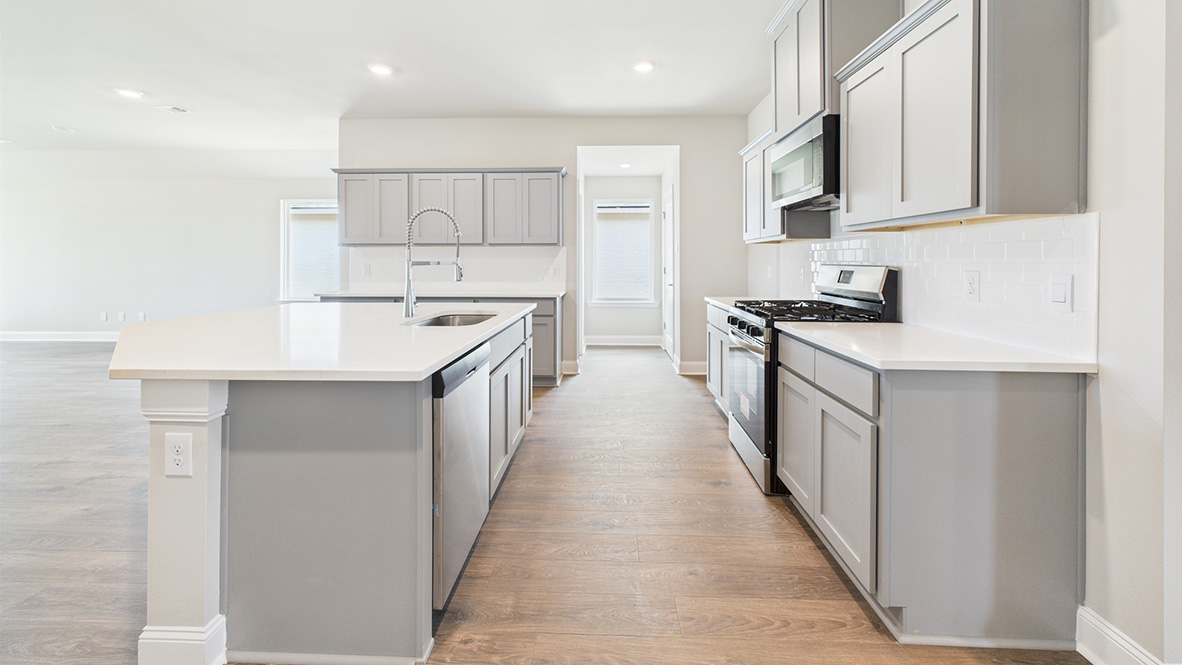 New appliances included, and a larger kitchen island, a sink, seating anchor our kitchen, pantry, near dining, living rooms