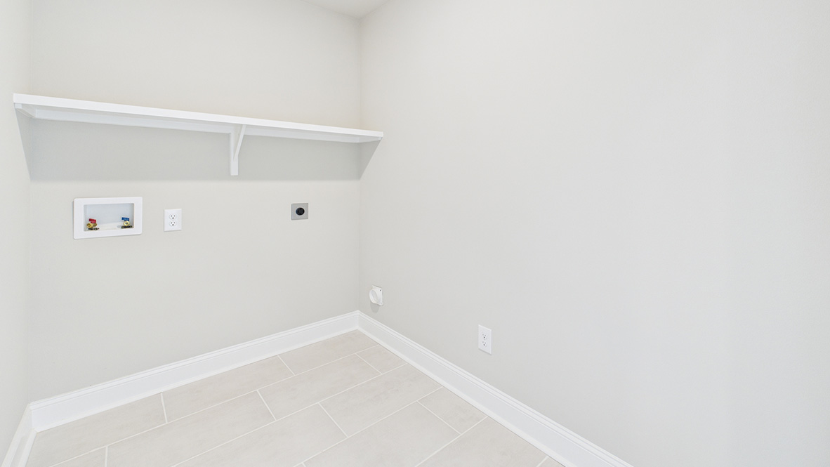 Ridgeland utility laundry smartly designed with overhead organized storage, a drop zone, with new washer, dryer included