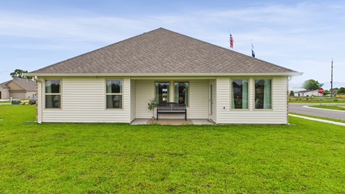 Covered patio with fully sodded yard
