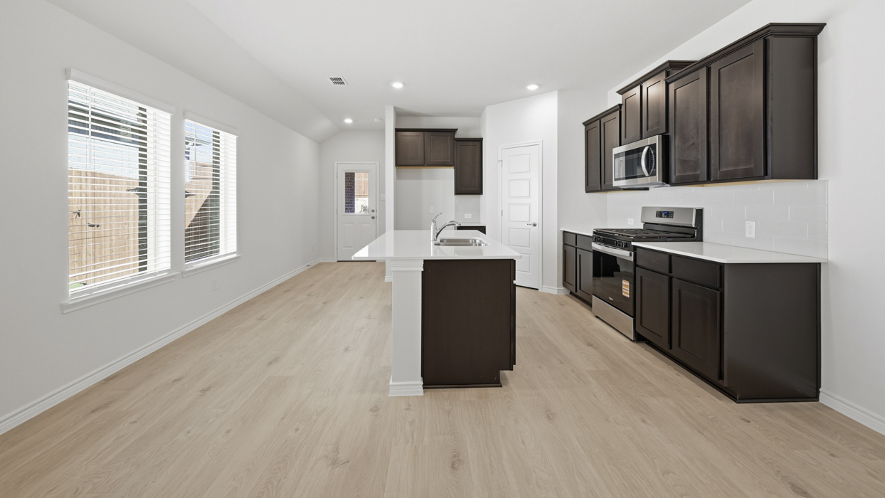 Douglas Plan  Kitchen Gallery Image-Silverado in Aubrey, TX