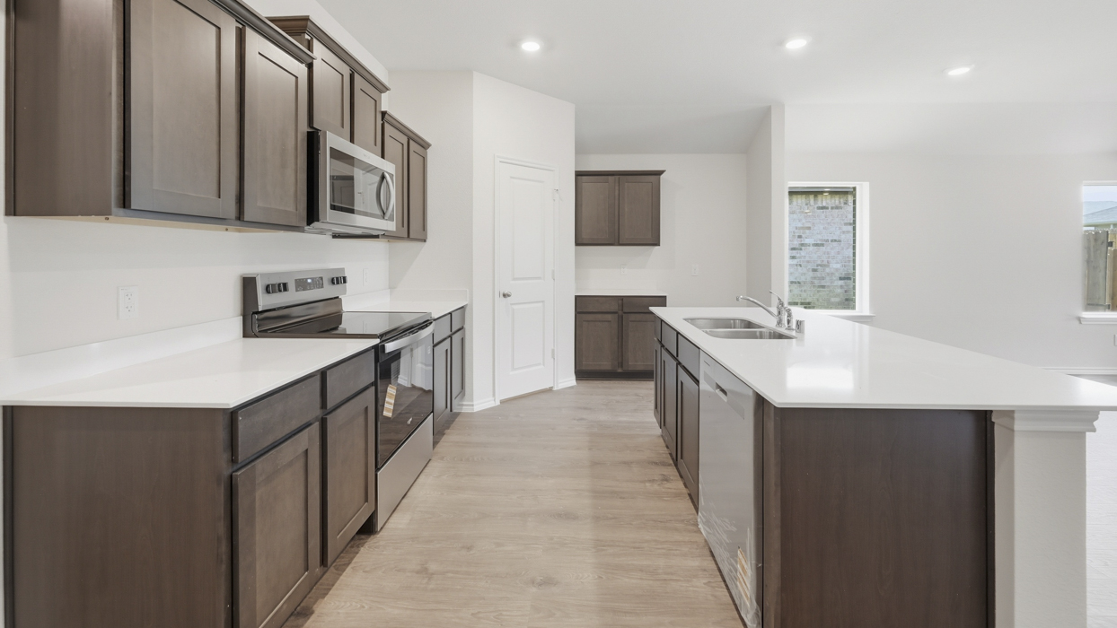 Lakeway Floorplan Elevation B Kitchen Gallery Image - Whitewing Trails in Princeton, TX