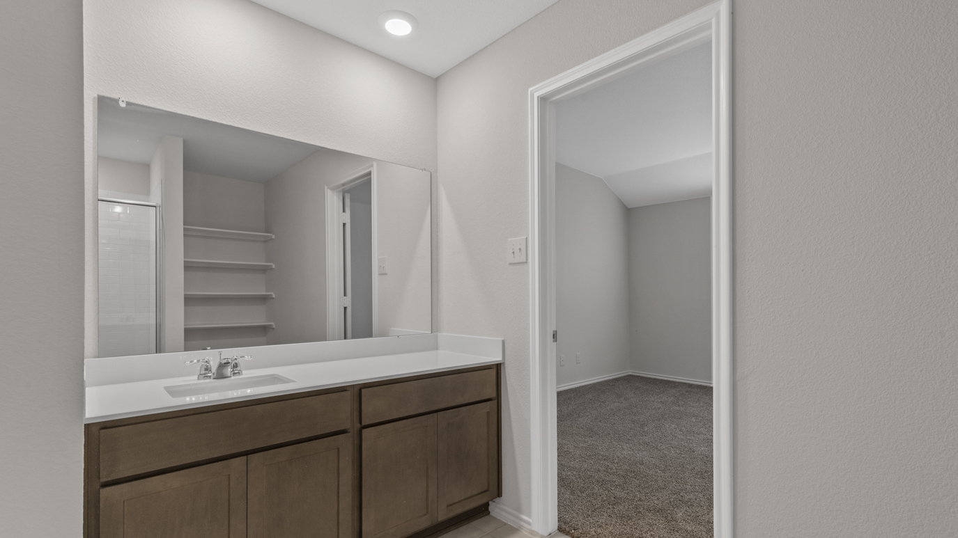 X40H Huntsville floorplan primary bedroom ensuite rendering at Stonewyck Farms in Ennis TX