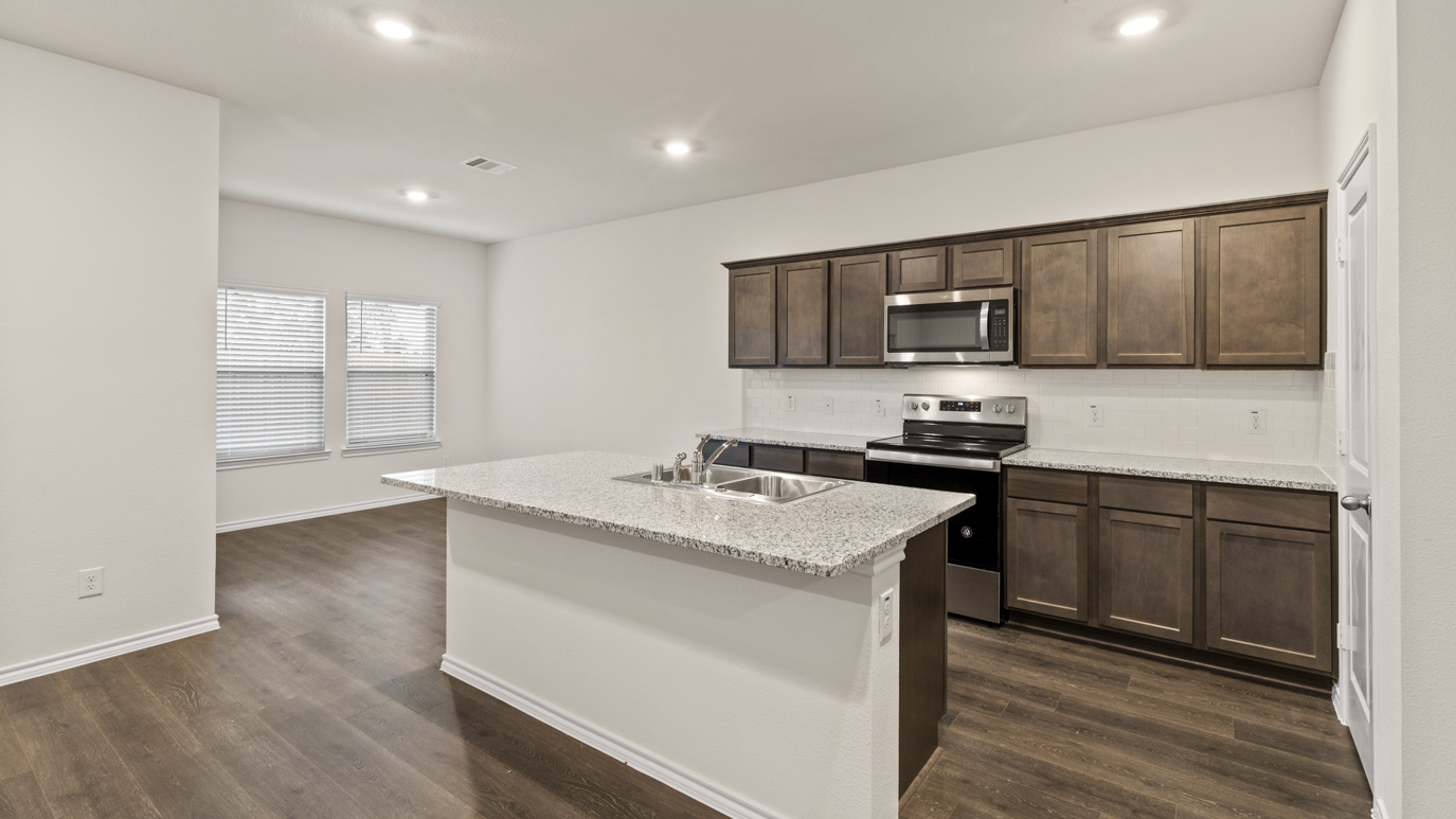 X40N floorplan kitchen rendering at Stonewyck Farms in Ennis TX