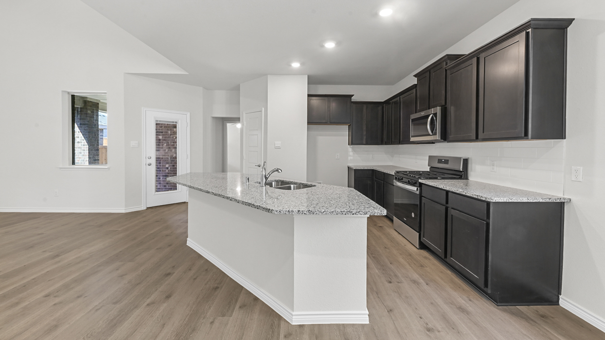 Chester Floorplan Elevation B Kitchen Gallery Image - The Woods at Lindsey Place in Anna, TX